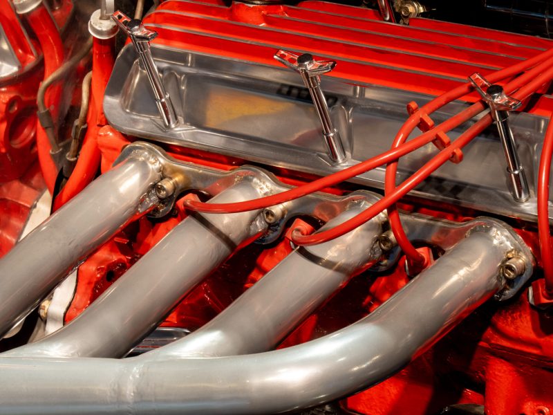 Red hot rod V8 engine manifold and spark plus wires
